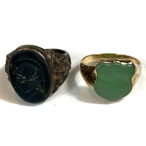 686 - An 18ct gold gentleman's signet ring with jade coloured shield shaped seal, 8.5gms; another with cra... 