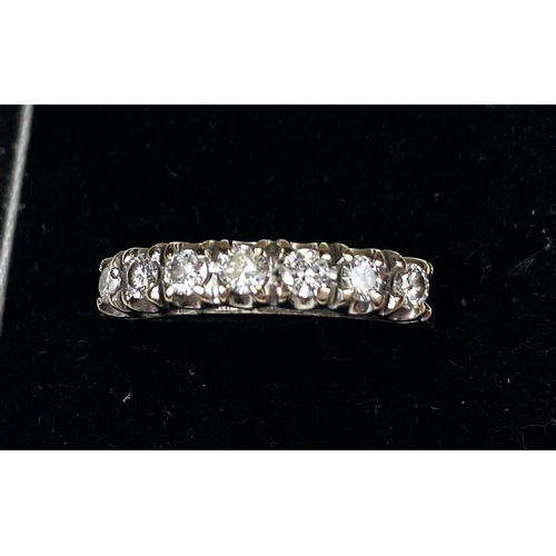 691 - HALF ETERNITY RING, an 18ct white gold half eternity ring set with 7 diamonds, 4.9gm gross weight, s... 