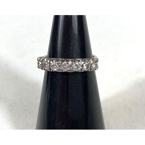 691 - HALF ETERNITY RING, an 18ct white gold half eternity ring set with 7 diamonds, 4.9gm gross weight, s... 