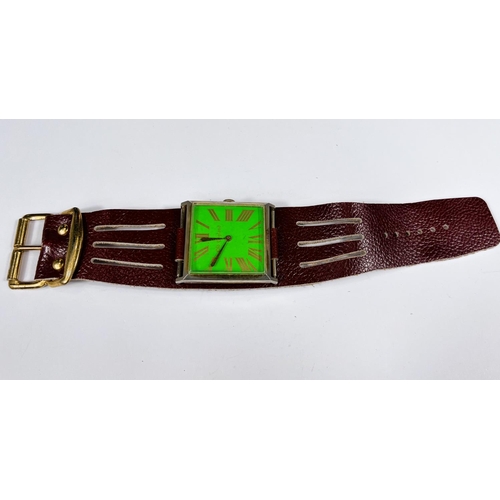 695 - A 1960s old English large dial pilot style wristwatch with square face green background gilt case an... 