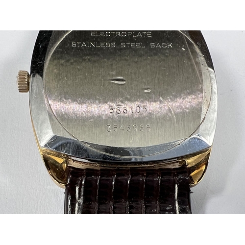 697 - A gentleman's gilt cased Universal Geneve 'Guilt Shadow' wristwatch with Batten numerals square face... 