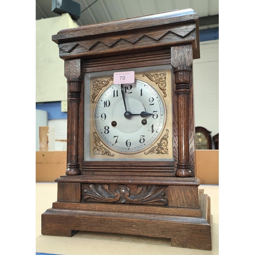 70 - An Edwardian oak cased mantel clock with strike