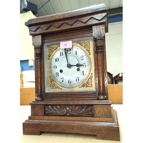 70 - An Edwardian oak cased mantel clock with strike