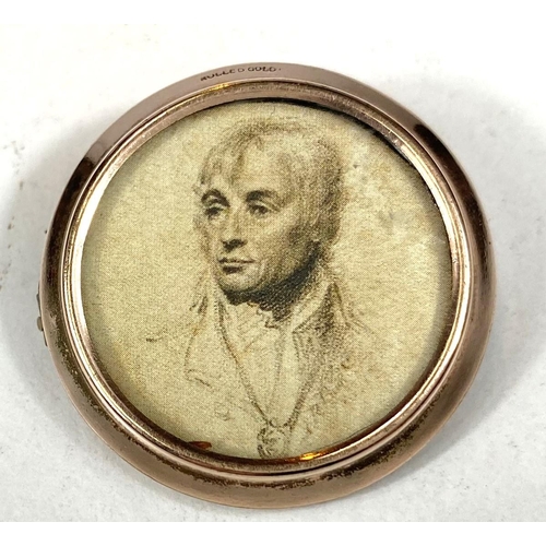 701 - A gold plated brooch, double sided with prints depicting Nelson and 2 children