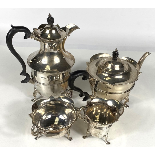 712 - A hallmarked silver 4 piece tea set of circular form with cut rims, on triple hoof feet, Sheffield 1... 