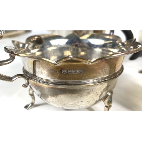 712 - A hallmarked silver 4 piece tea set of circular form with cut rims, on triple hoof feet, Sheffield 1... 