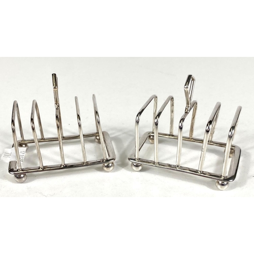 716 - A hallmarked silver pair of 4 division toast racks, Birmingham 1927, 2.5oz