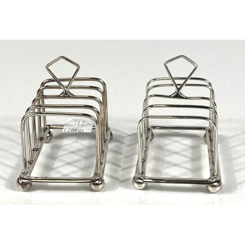 716 - A hallmarked silver pair of 4 division toast racks, Birmingham 1927, 2.5oz