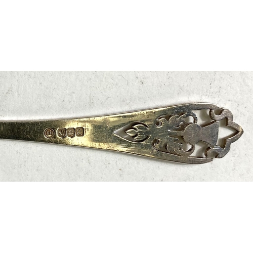 718 - A Scottish hallmarked silver pair of spoon and fork pickle servers with pierced thistle terminals; 3... 