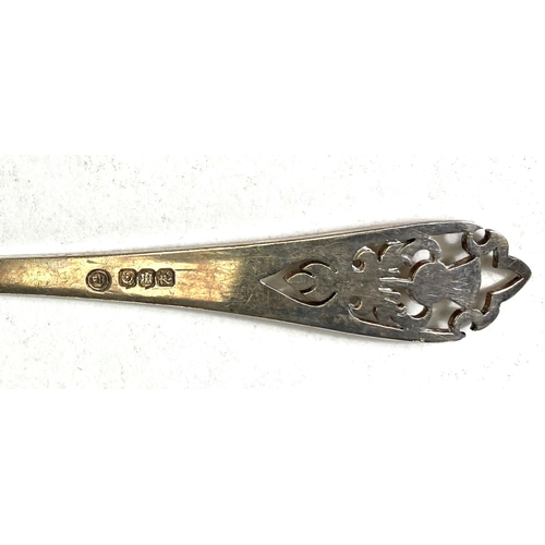 718 - A Scottish hallmarked silver pair of spoon and fork pickle servers with pierced thistle terminals; 3... 