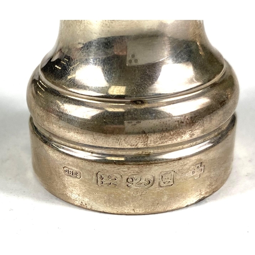 719 - A hallmarked silver pair of pepper grinders, London, date marks worn