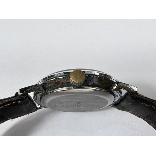 749 - A mid 20th century Doxa Swiss made gents wrist watch with stainless steel case baton markers and a l... 