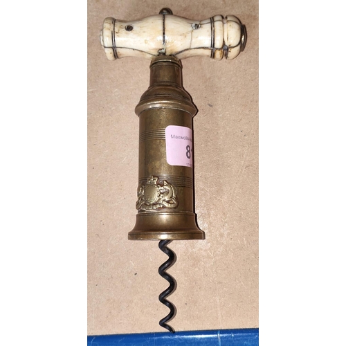 81 - A 19th century double twist corkscrew in brass with bone handle