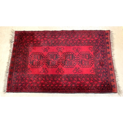 833 - An Afghan rug 180 x 115cm