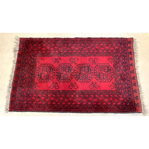 833 - An Afghan rug 180 x 115cm