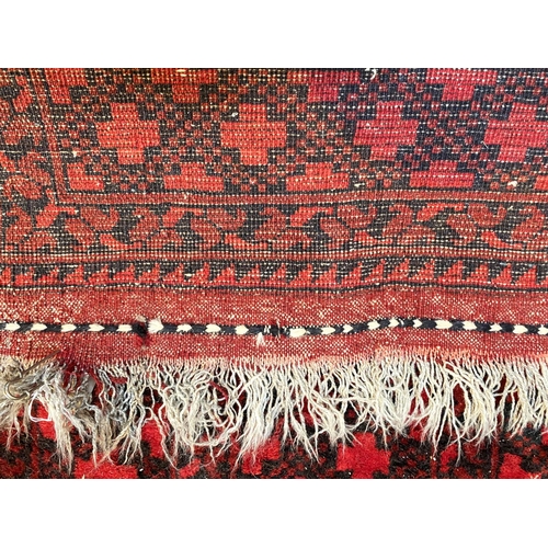 834 - An Afghan carpet 360 x 306 cm