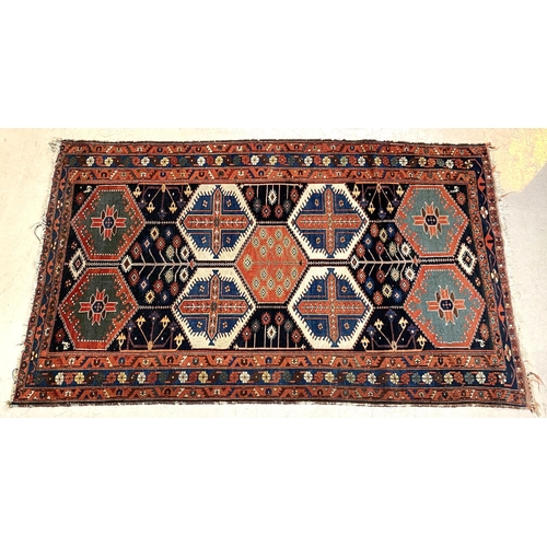 836 - An antique Turkey rug, geometric motifs, 215 x 132cm