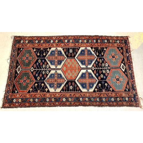 836 - An antique Turkey rug, geometric motifs, 215 x 132cm