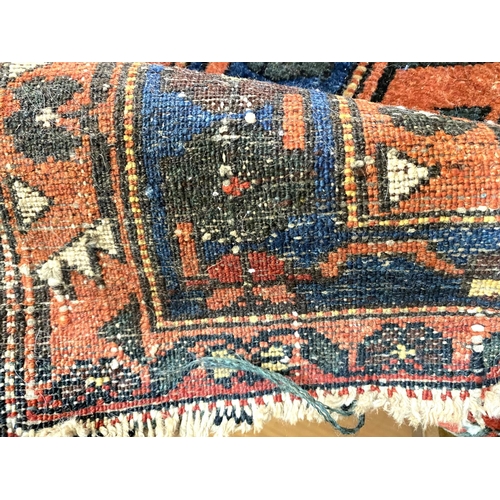 836 - An antique Turkey rug, geometric motifs, 215 x 132cm