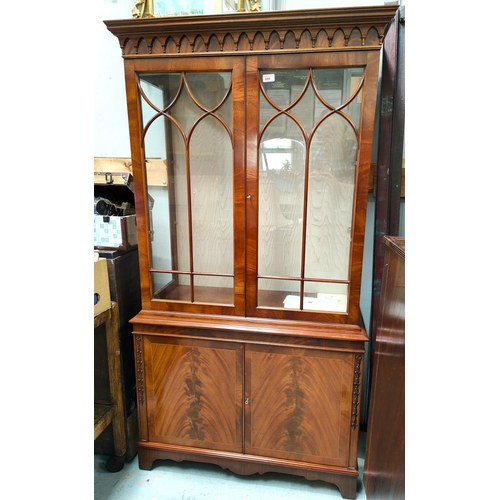 859 - A mahogany reproduction full height display/book case with double figured doors below and astragal g... 