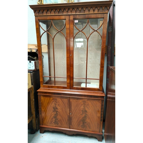 859 - A mahogany reproduction full height display/book case with double figured doors below and astragal g... 