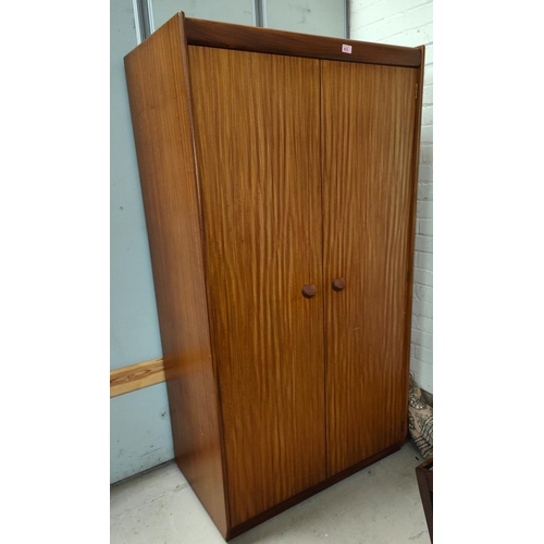 872 - A mid 20th century teak, two door wardrobe with interior drawers 92 x 170 x 57cm and a matching inte... 