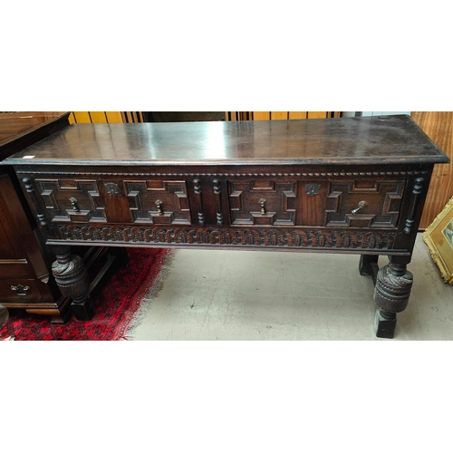 902 - A late 19th/early 20th century heavy oak Jacobean style dresser base with two panel drawers, turned ... 