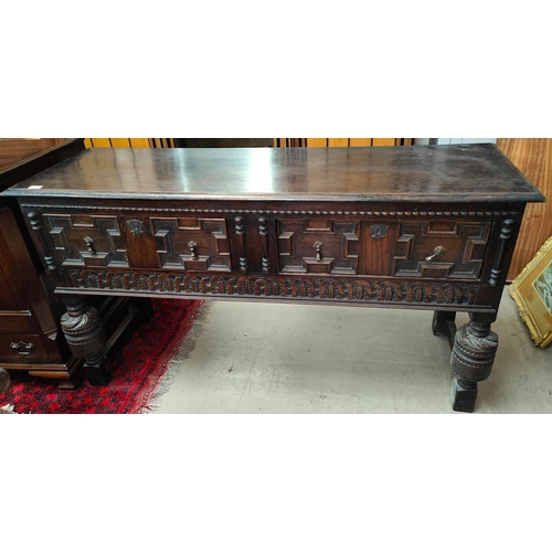 902 - A late 19th/early 20th century heavy oak Jacobean style dresser base with two panel drawers, turned ... 