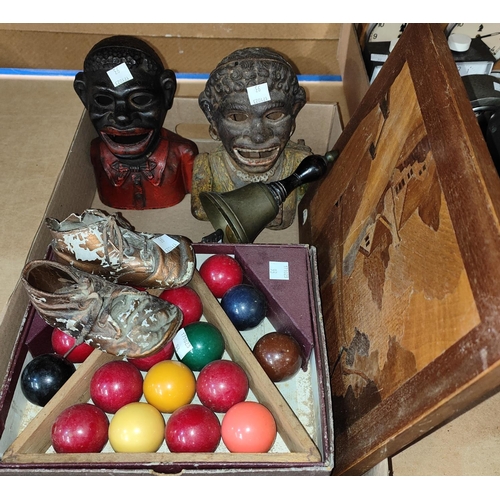 93 - Two Victorian cast iron 'Black Boy' money boxes; a pair of baby boots; a set of snooker balls; etc.