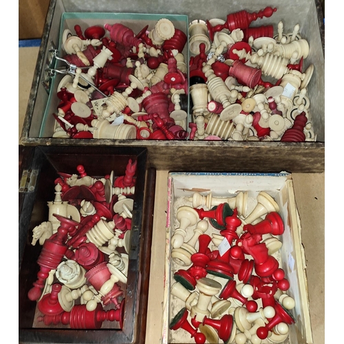 95 - A large selection of stained red and bone chess pieces