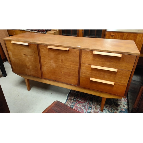 964 - A mid 20th century teak sideboard with fall front cocktail unit, single cupboard and 3 drawers