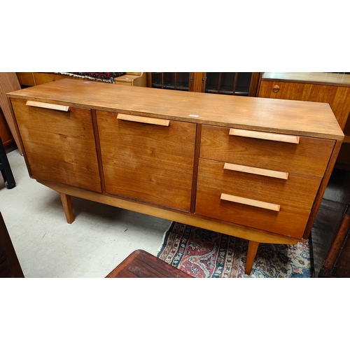 964 - A mid 20th century teak sideboard with fall front cocktail unit, single cupboard and 3 drawers