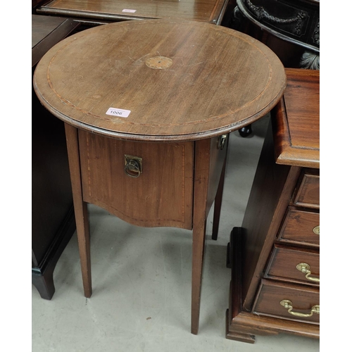 1006 - A circular Edwardian inlaid mahogany occasional table with 4 drop flaps for plates