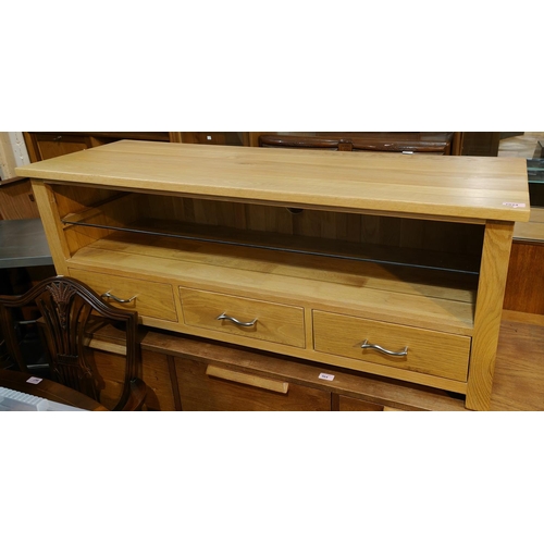 1024 - A modern light oak low unit with shelf below and three drawers