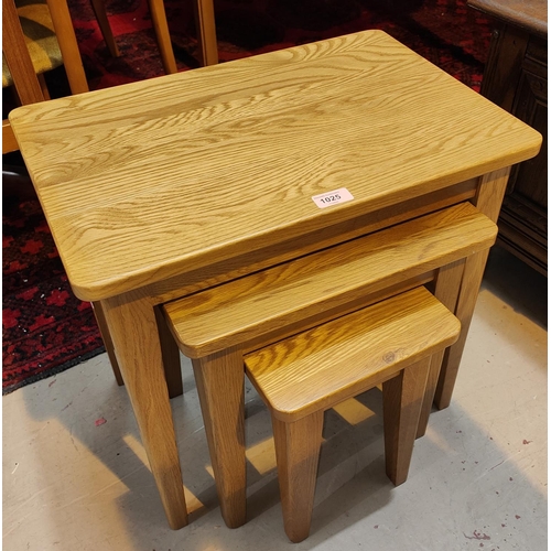 1025 - A nest of 3 modern light oak tables