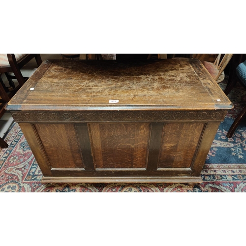 1031 - A 1930's panelled oak blanket box.