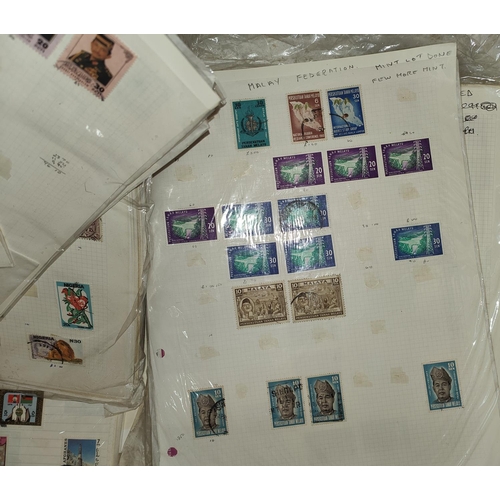 232 - WORLD STAMPS: a large collection on sheets