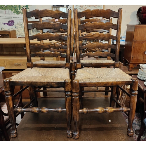 847 - Four Titchmarsh and Goodwin rush seat dining chairs with ladder backs.