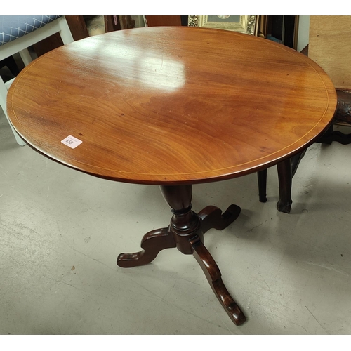 856 - A 19th Century mahogany oval pedestal table, inlaid on column with three splay feet. 71cm 