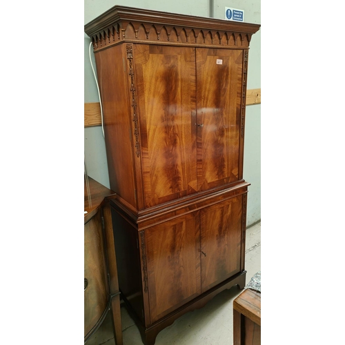 861 - A mahogany reproduction Cocktail Cabinet with double doors above with mirrored compartment and doubl... 