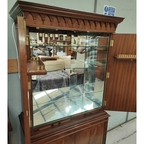 861 - A mahogany reproduction Cocktail Cabinet with double doors above with mirrored compartment and doubl... 