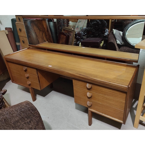 873 - Mid 20th century teak dressing table full length mirror, six draws and a stool. Length 162cm 