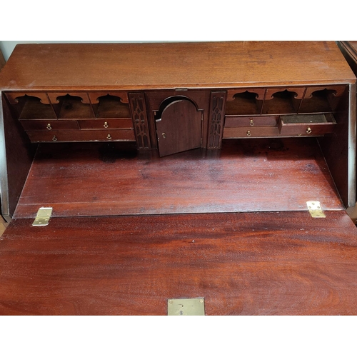 917 - A Georgian mahogany bureau with fall front, fitted interior, 3 long and 2 sort drawers with brass sw... 