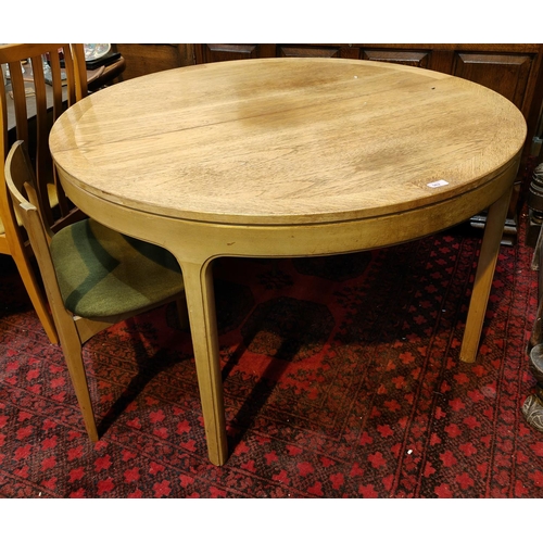 962 - A mid 20th century teak circular extending dining table, 120cm diameter, leaf 47cm and 3 teak dining... 