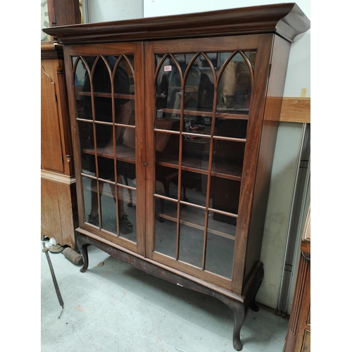 978 - A large mahogany double door display cabinet with arched astragal glazed doors 156 x 131cm