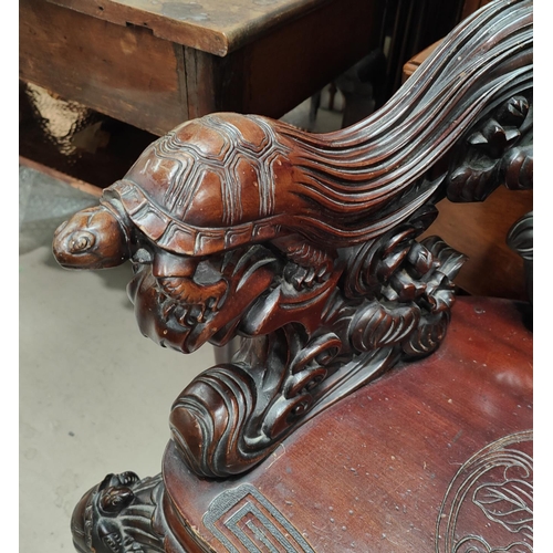 985 - An impressive Chinese/Japanese elaborately carved softwood tub arm chair with Crane to the back, Tor... 