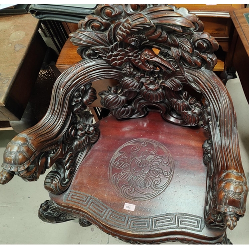 985 - An impressive Chinese/Japanese elaborately carved softwood tub arm chair with Crane to the back, Tor... 