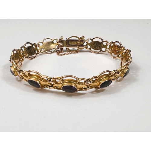 607 - An Edwardian 9ct gold amethyst set (12 stones) bracelet, 9.2gms. (approx. 18cm length)