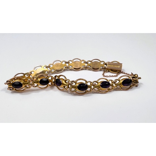 607 - An Edwardian 9ct gold amethyst set (12 stones) bracelet, 9.2gms. (approx. 18cm length)