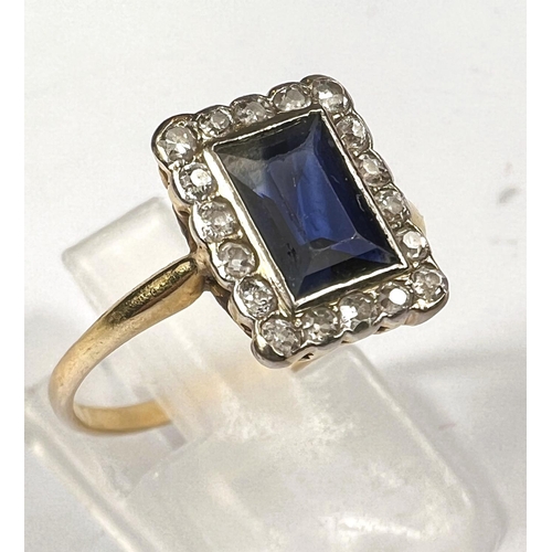 608 - Art Deco, unmarked gold ring with large rectangular sapphire 8mm x 6mm approx, surrounded by 18 diam... 